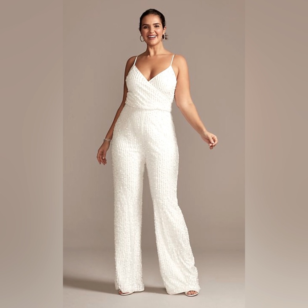 Never worn SEQUIN SPAGHETTI STRAP
PLUS SIZE JUMPSUIT DAVIDS BRIDAL